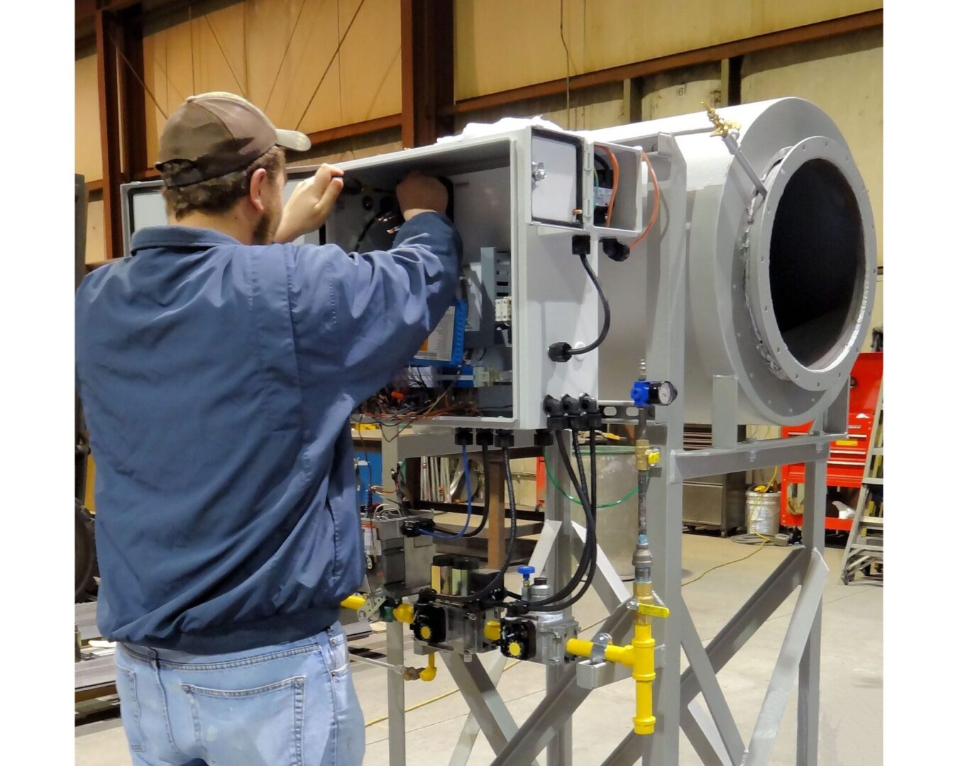 A man working on an industrial machine.