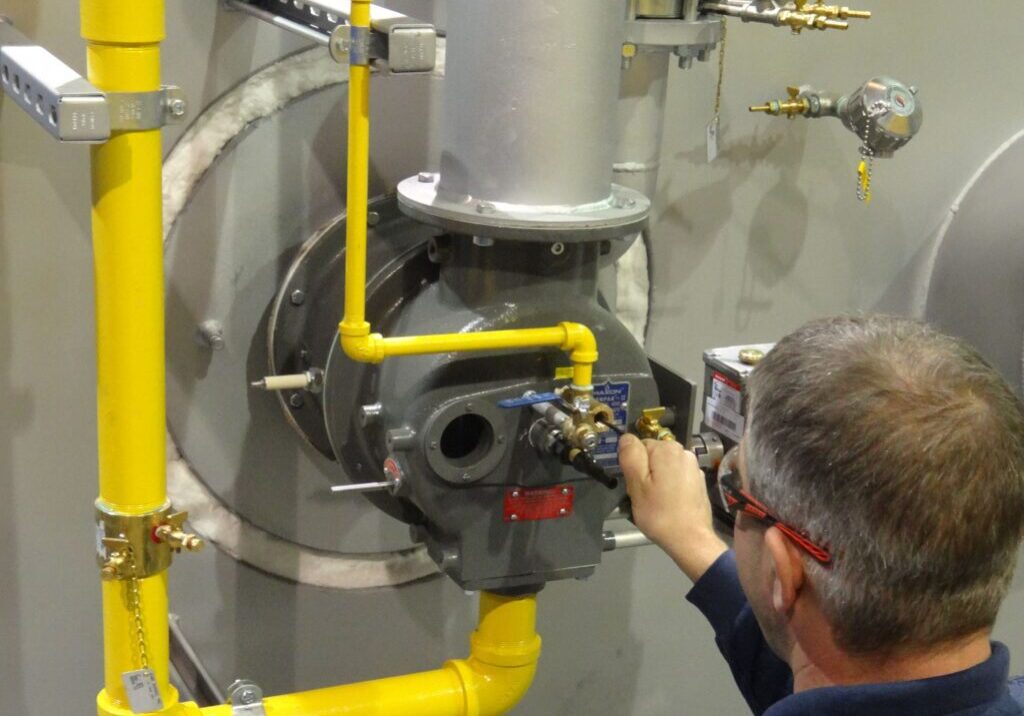 A man working on an industrial machine.