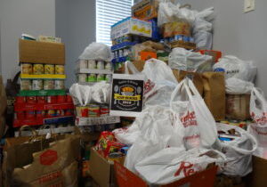 A room filled with lots of food and bags.