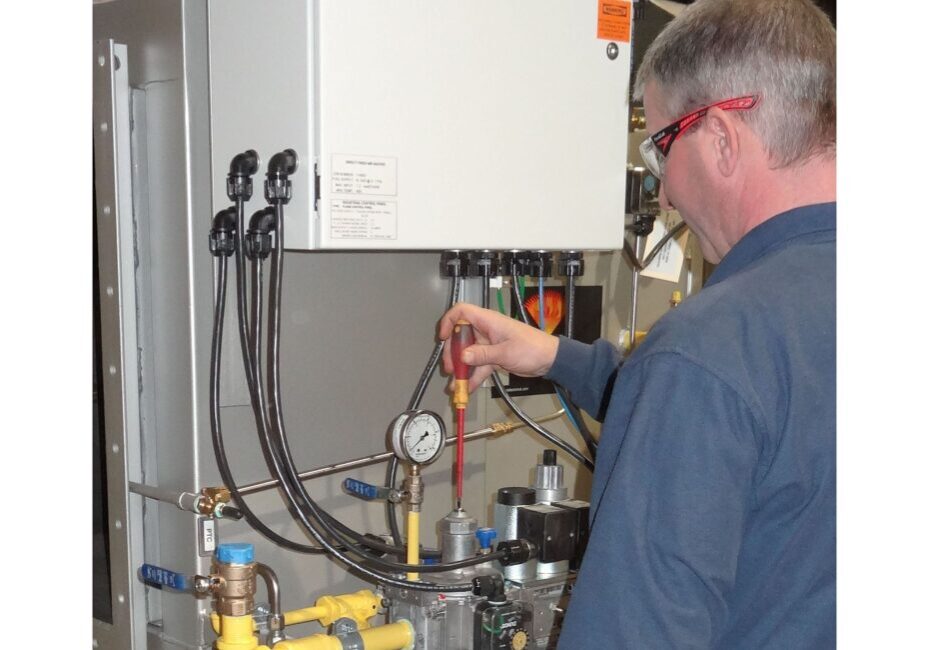 A man working on an industrial device