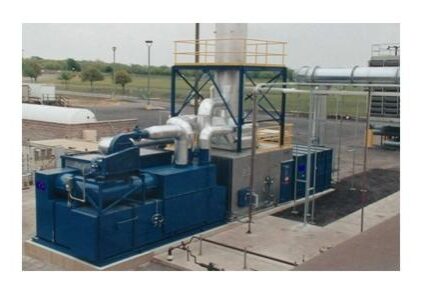 A large blue machine is next to a metal structure.